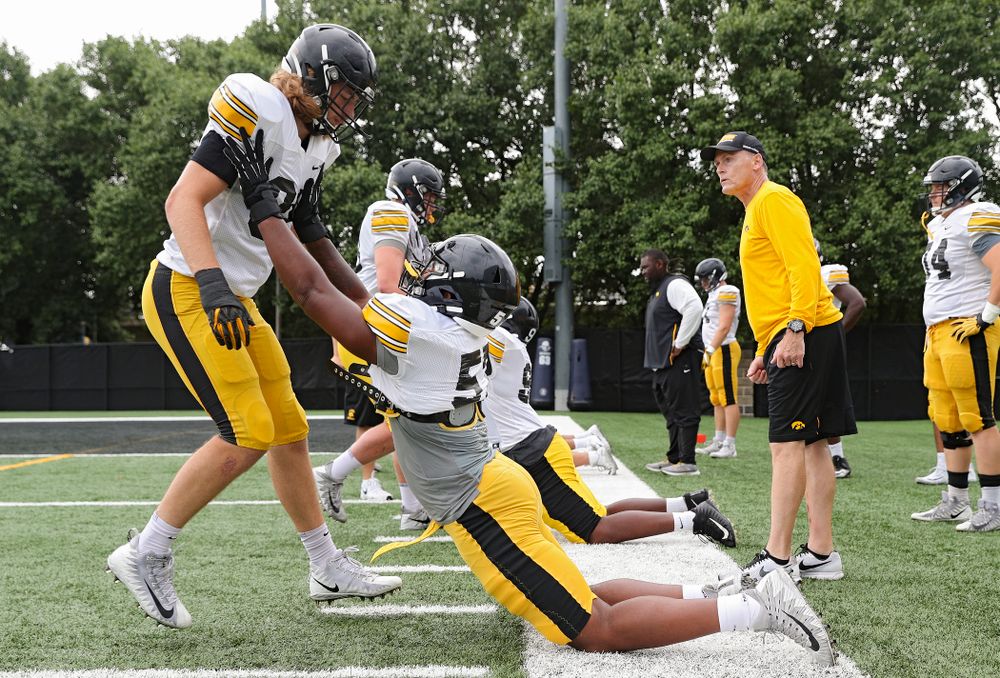 Iowa Hawkeyes defensive lineman Chris Reames (from left) and defensive end Chauncey Golston (57) run a drill durning Fall Camp Practice No. 17 at the Hansen Football Performance Center in Iowa City on Wednesday, Aug 21, 2019. (Stephen Mally/hawkeyesports.com)