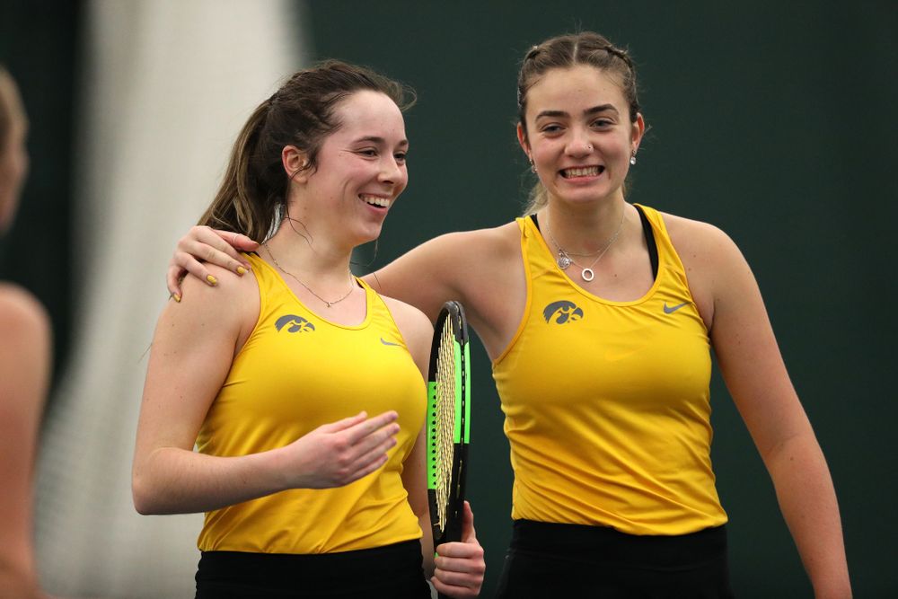 Iowa's Sam Mannix and Sophie Clark celebrate after winning their doubles match against Xavier Friday, January 18, 2019 at the Hawkeye Tennis and Recreation Center. (Brian Ray/hawkeyesports.com)