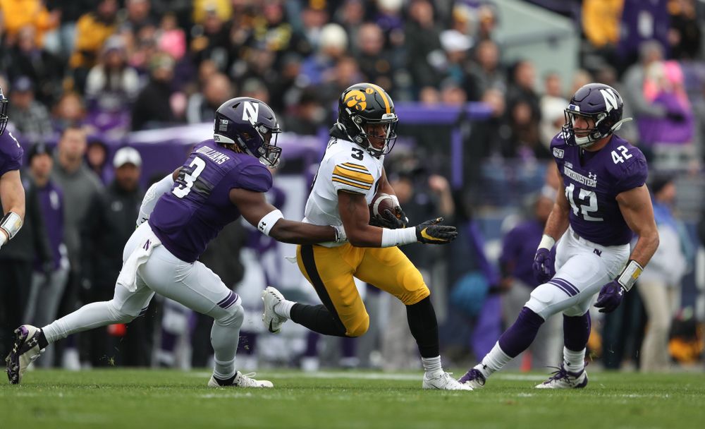 Iowa Hawkeyes wide receiver Tyrone Tracy Jr. (3) carries the ball on his way to a touchdown against the Northwestern Wildcats Saturday, October 26, 2019 at Ryan Field in Evanston, Ill. (Brian Ray/hawkeyesports.com)