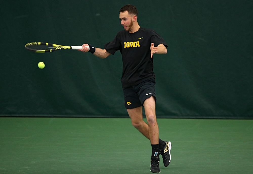 Iowa’s Kareem Allaf returns a shot during his doubles match at the Hawkeye Tennis and Recreation Complex in Iowa City on Friday, March 6, 2020. (Stephen Mally/hawkeyesports.com)