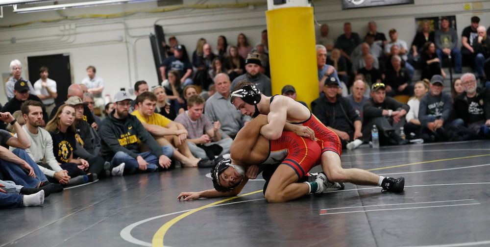 Aaron Cashman and Spencer Lee wrestle in front of a packed house at the Dan Gable Wrestling Complex. 