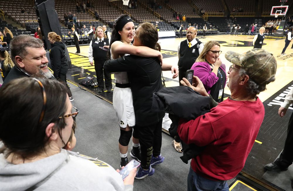 Iowa Hawkeyes forward Megan Gustafson (10) hugs her mother Eva following their game against the Illinois Fighting Illini Thursday, February 14, 2019 at Carver-Hawkeye Arena. (Brian Ray/hawkeyesports.com)