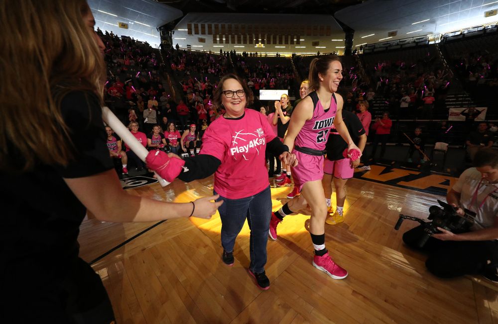 Iowa Hawkeyes forward Hannah Stewart (21) is introduced with a cancer survivor before their game against the seventh ranked Maryland Terrapins Sunday, February 17, 2019 at Carver-Hawkeye Arena. (Brian Ray/hawkeyesports.com)