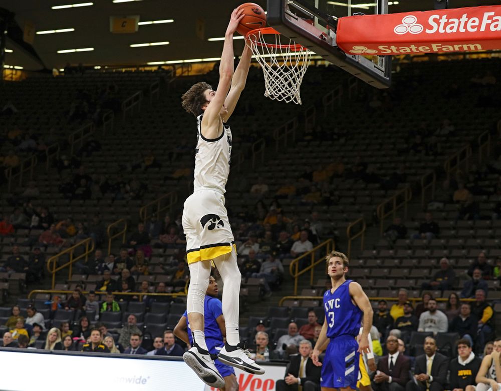 Iowa Hawkeyes forward Patrick McCaffery (22) dunks the ball during the second half of their exhibition game against Lindsey Wilson College at Carver-Hawkeye Arena in Iowa City on Monday, Nov 4, 2019. (Stephen Mally/hawkeyesports.com)