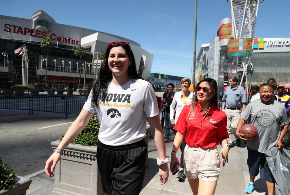 Iowa Hawkeyes forward Megan Gustafson (10) walks past the Staples Center following  a Special Olympics event Friday, April 12, 2019 as part of the ESPN College Basketball Awards in the XBOX Plaza at LA Live.  (Brian Ray/hawkeyesports.com)