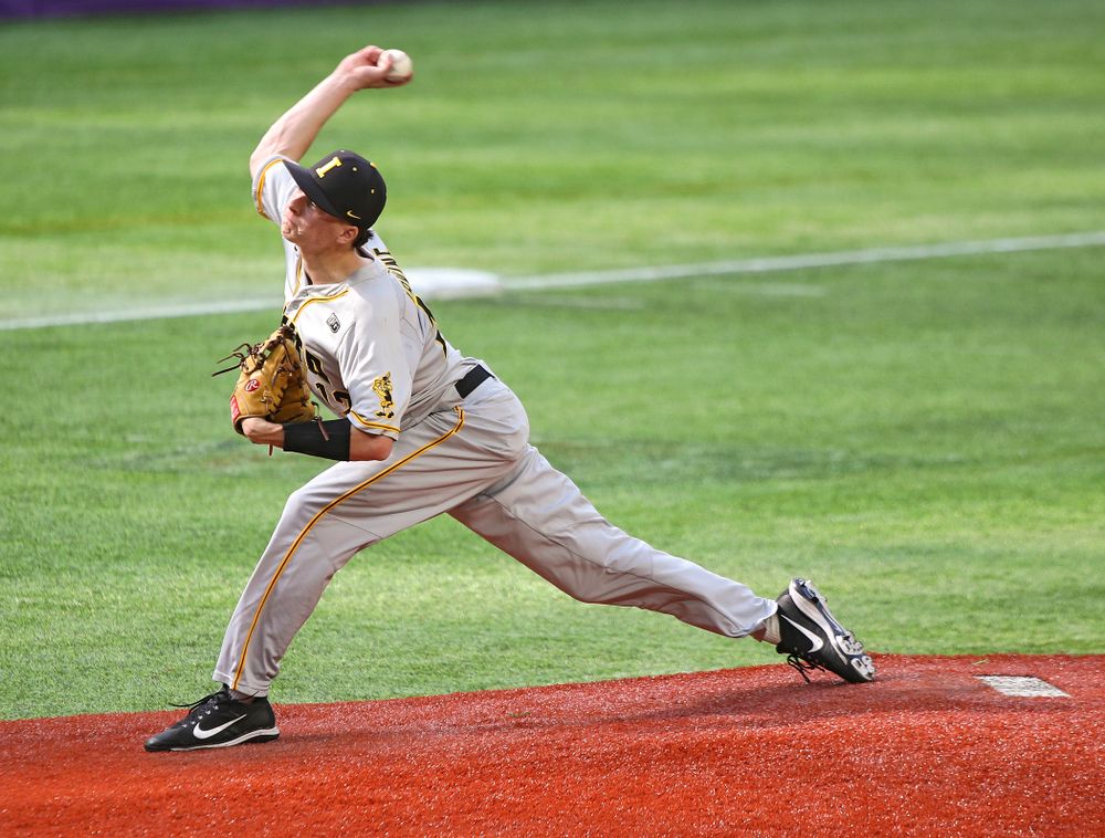 Iowa Hawkeyes pitcher Drew Irvine (12) delivers to the plate during the sixth inning of their CambriaCollegeClassic game at U.S. Bank Stadium in Minneapolis, Minn. on Friday, February 28, 2020. (Stephen Mally/hawkeyesports.com)