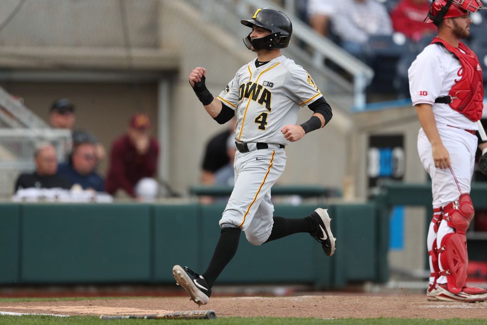 Iowa Hawkeyes infielder Mitchell Boe (4) scores against the Indiana Hoosiers in the first round of the Big Ten Baseball Tournament Wednesday, May 22, 2019 at TD Ameritrade Park in Omaha, Neb. (Brian Ray/hawkeyesports.com)