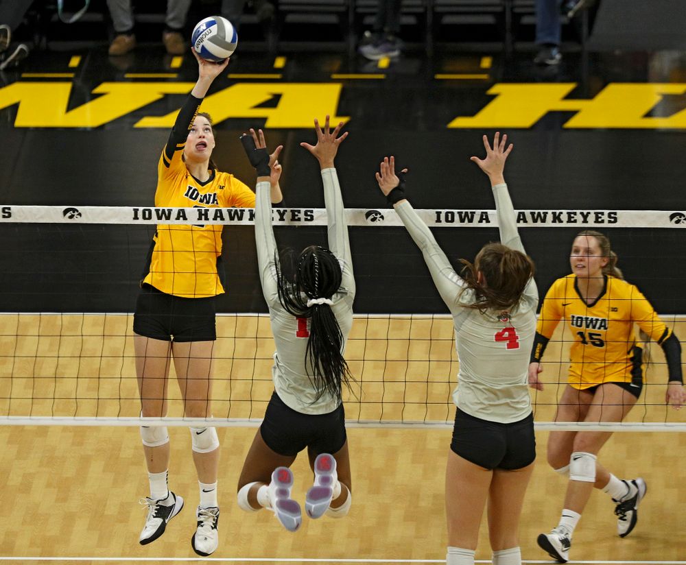 Iowa’s Courtney Buzzerio (2) tips the ball over the net during the second set of their match at Carver-Hawkeye Arena in Iowa City on Friday, Nov 29, 2019. (Stephen Mally/hawkeyesports.com)