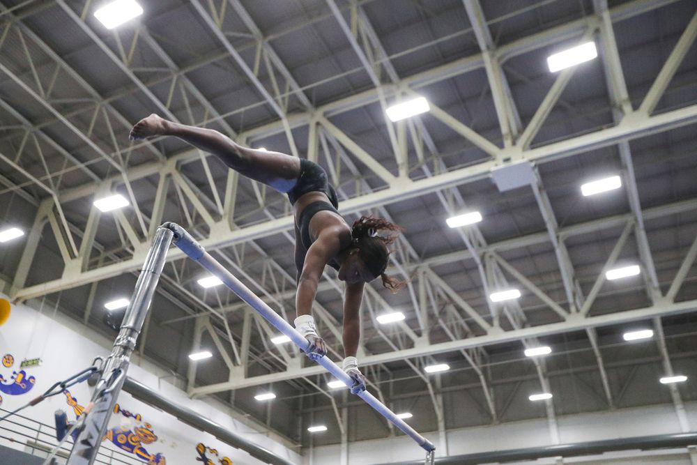 Jerquavia Henderson performs on the uneven bars during the Iowa women’s gymnastics Black and Gold Intraquad Meet on Saturday, December 7, 2019 at the UI Field House. (Lily Smith/hawkeyesports.com)