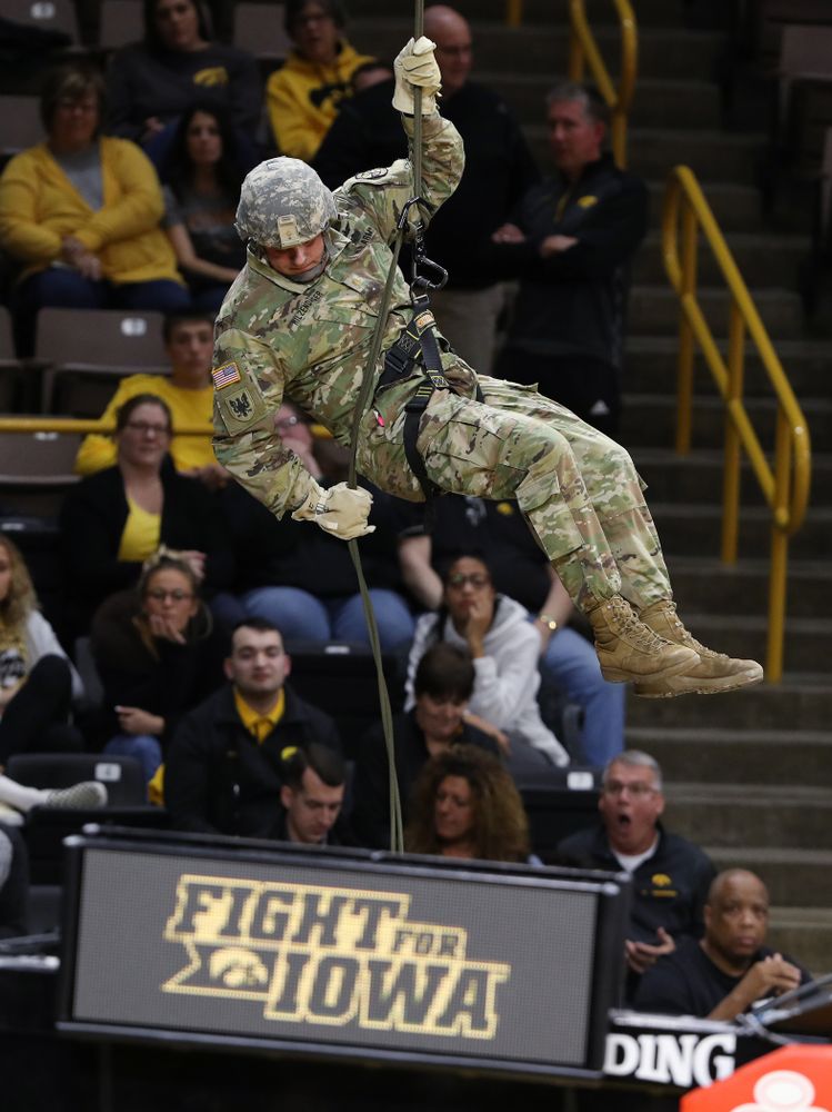 Members of the University of Iowa ROTC cadre repel down from the rafters before the Iowa Hawkeyes game against UW Green Bay Sunday, November 11, 2018 at Carver-Hawkeye Arena. (Brian Ray/hawkeyesports.com)