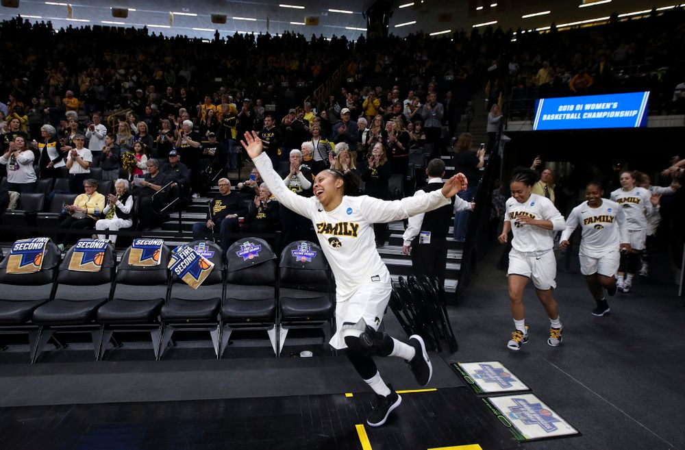Iowa Hawkeyes guard Tania Davis (11) leads the team onto the court during the first round of the 2019 NCAA Women's Basketball Tournament at Carver Hawkeye Arena in Iowa City on Friday, Mar. 22, 2019. (Stephen Mally for hawkeyesports.com)