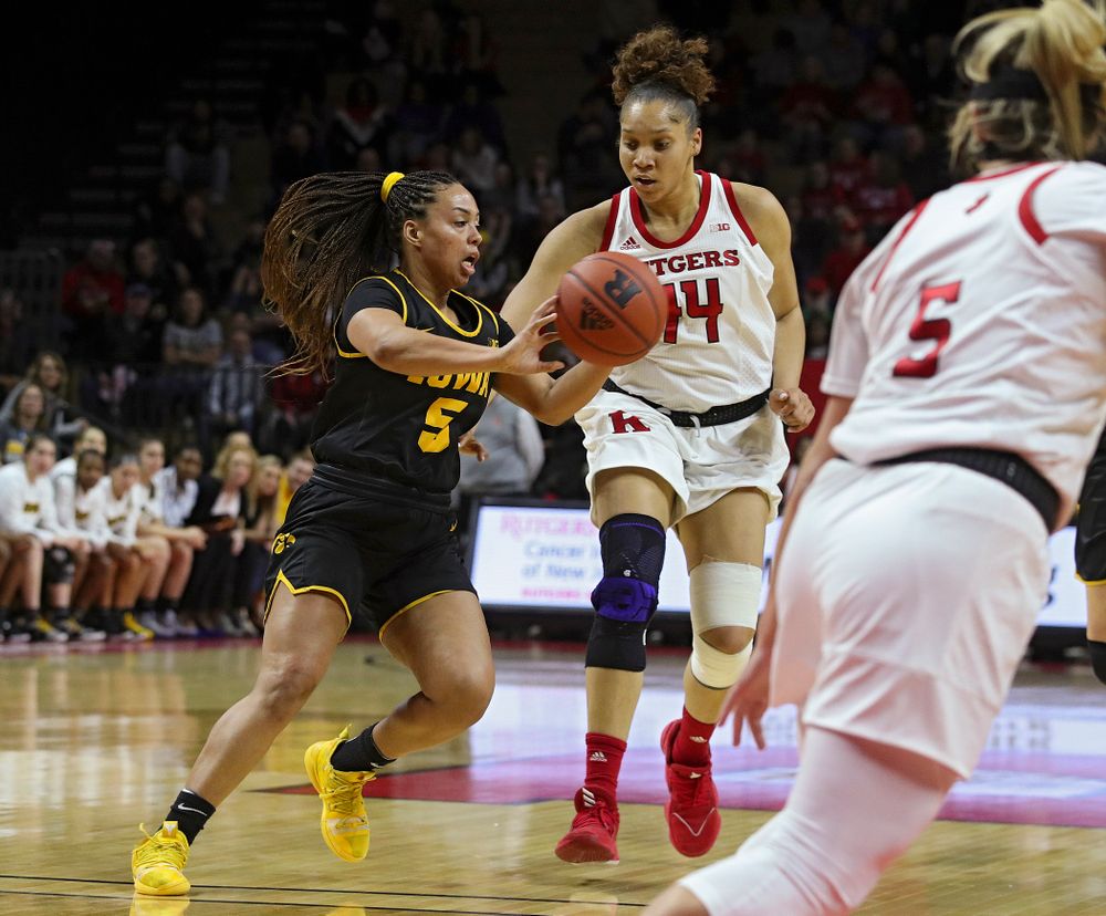 Iowa guard Alexis Sevillian (5) passes the ball during the first quarter of their game at the Rutgers Athletic Center in Piscataway, N.J. on Sunday, March 1, 2020. (Stephen Mally/hawkeyesports.com)