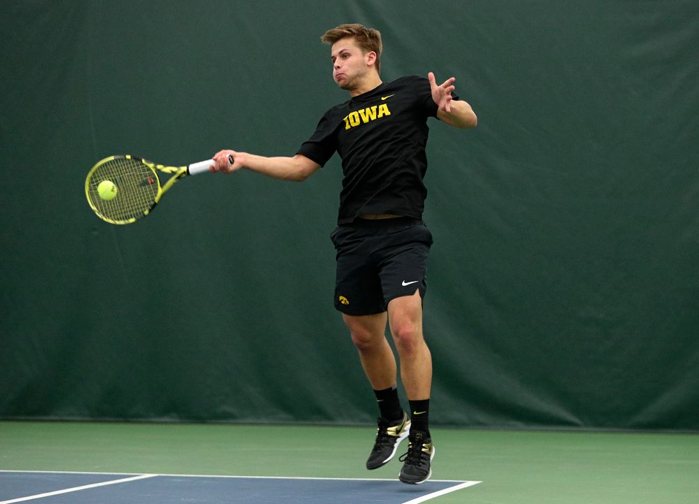 Iowa’s Will Davies returns a shot during his singles match at the Hawkeye Tennis and Recreation Complex in Iowa City on Friday, March 6, 2020. (Stephen Mally/hawkeyesports.com)