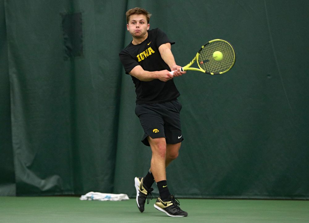 Iowa’s Will Davies returns a shot during his singles match at the Hawkeye Tennis and Recreation Complex in Iowa City on Friday, March 6, 2020. (Stephen Mally/hawkeyesports.com)