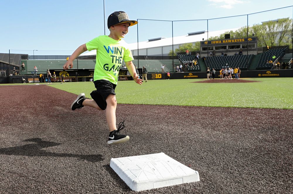 Kids run the bases after Iowa's game against UC Irvine at Duane Banks Field in Iowa City on Sunday, May. 5, 2019. (Stephen Mally/hawkeyesports.com)