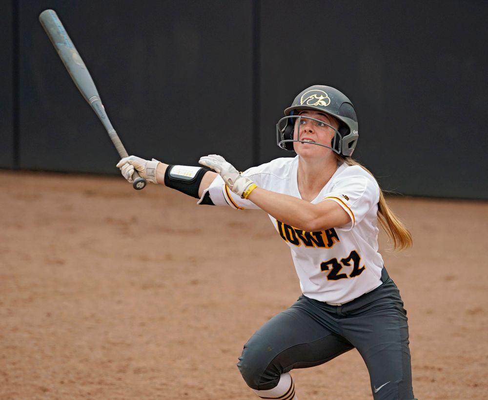 Iowa Hawkeyes Hallie Ketcham (22) drives a pitch for a hit during the sixth inning of their Big Ten Conference softball game at Pearl Field in Iowa City on Friday, Mar. 29, 2019. (Stephen Mally/hawkeyesports.com)