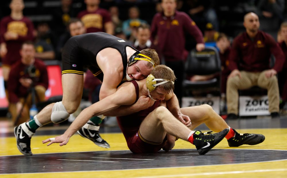 Iowa's Alex Marinelli wrestles Minnesota's Nick Wanzek at 165 pounds 