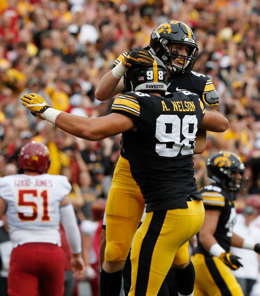 Iowa Hawkeyes linebacker Nick Niemann (49) celebrates with defensive end Anthony Nelson (98) after sacking Iowa State Cyclones quarterback Kyle Kempt (17) Saturday, September 8, 2018 at Kinnick Stadium. (Brian Ray/hawkeyesports.com)