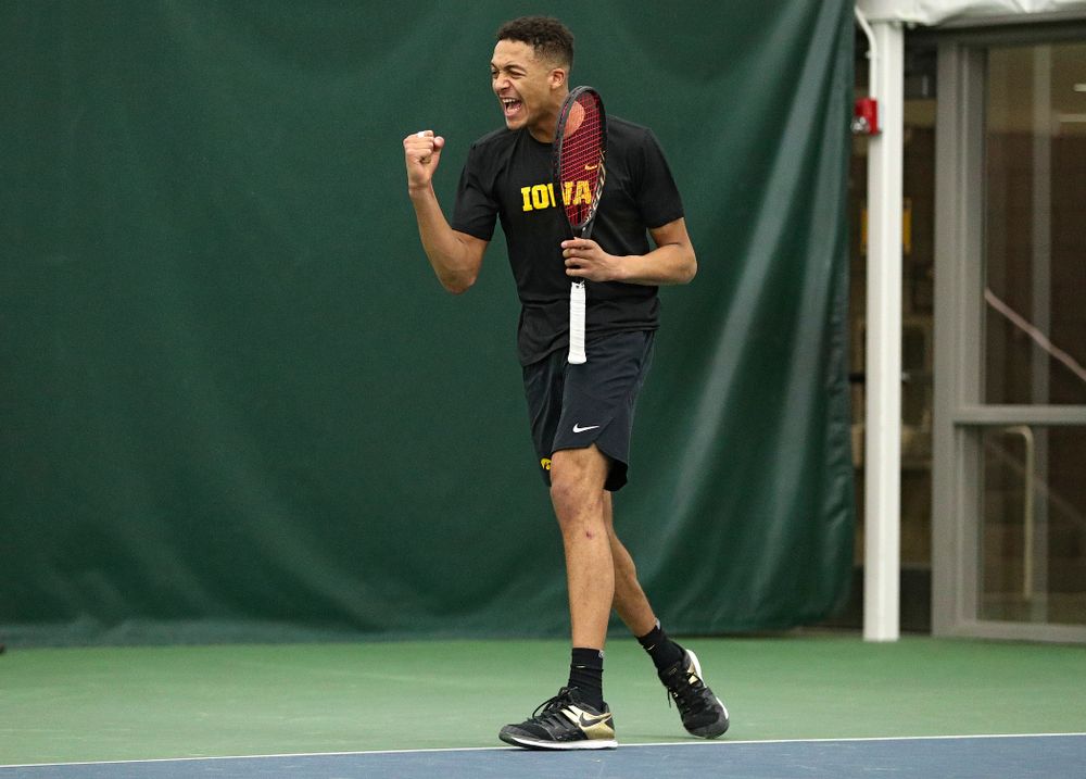 Iowa’s Oliver Okonkwo celebrates a point during his singles match at the Hawkeye Tennis and Recreation Complex in Iowa City on Friday, February 14, 2020. (Stephen Mally/hawkeyesports.com)