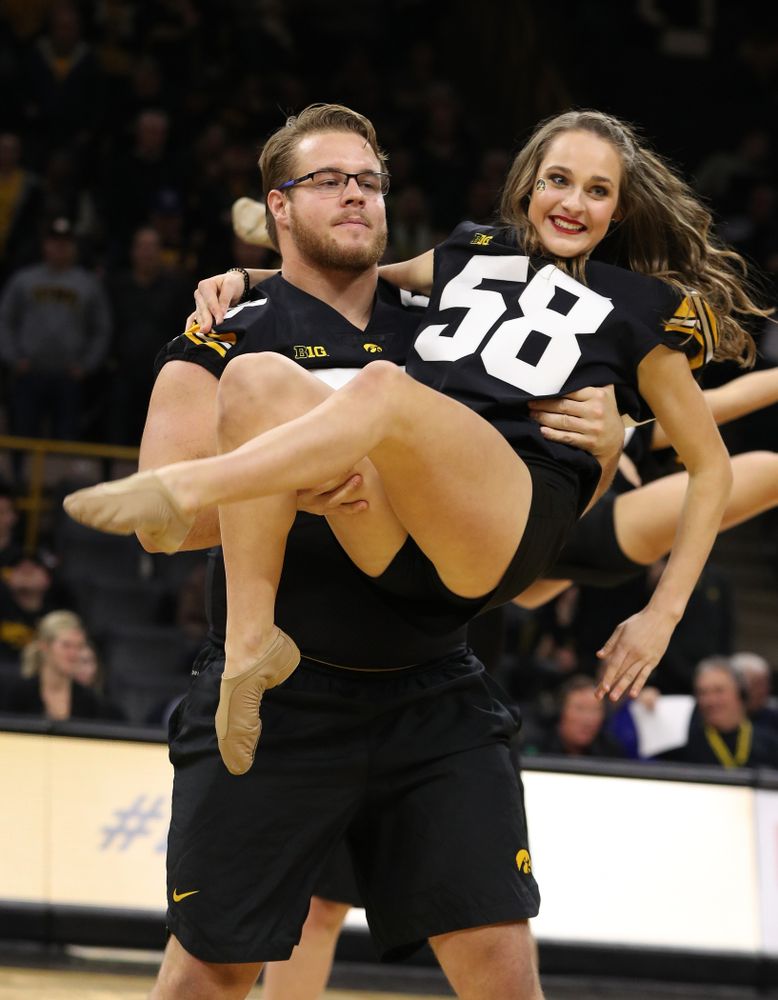The Iowa Dance Team performs with the Iowa Football Team at halftime of the Iowa Hawkeyes game against the Indiana Hoosiers Friday, February 22, 2019 at Carver-Hawkeye Arena. (Brian Ray/hawkeyesports.com)