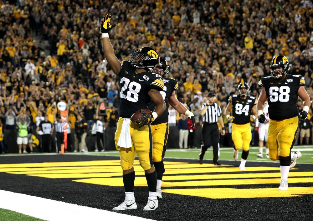 Iowa Hawkeyes running back Toren Young (28) celebrates a touchdown against the Miami RedHawks Saturday, August 31, 2019 at Kinnick Stadium in Iowa City. (Brian Ray/hawkeyesports.com)