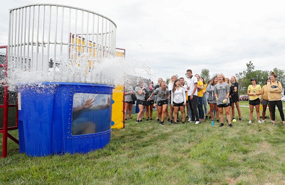 Iowa Track and Field assistant coach Eric Werskey drops into the water in the dunk tank during the Student-Athlete Kickoff outside the Karro Athletics Hall of Fame Building in Iowa City on Sunday, Aug 25, 2019. (Stephen Mally/hawkeyesports.com)