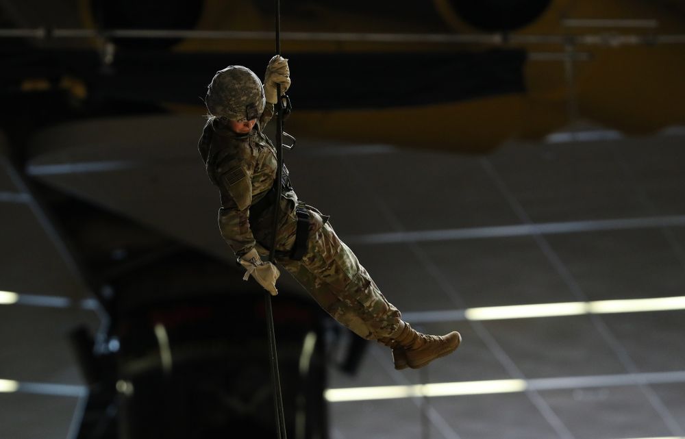 Members of the University of Iowa ROTC cadre repel down from the rafters before the Iowa Hawkeyes game against UW Green Bay Sunday, November 11, 2018 at Carver-Hawkeye Arena. (Brian Ray/hawkeyesports.com)