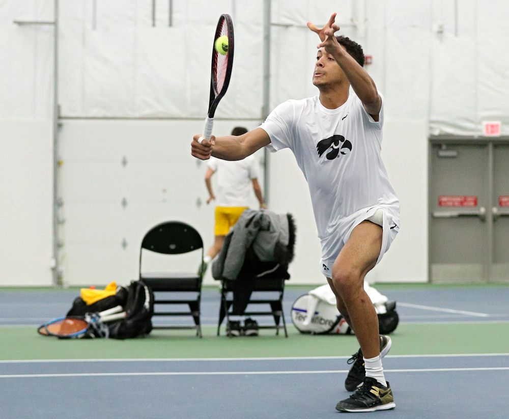 Iowa’s Oliver Okonkwo returns a shot during his doubles match at the Hawkeye Tennis and Recreation Complex in Iowa City on Sunday, February 16, 2020. (Stephen Mally/hawkeyesports.com)