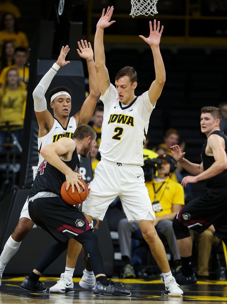 Iowa Hawkeyes forward Cordell Pemsl (35) and Iowa Hawkeyes forward Jack Nunge (2) defend in the paint during a game against Guilford College at Carver-Hawkeye Arena on November 4, 2018. (Tork Mason/hawkeyesports.com)