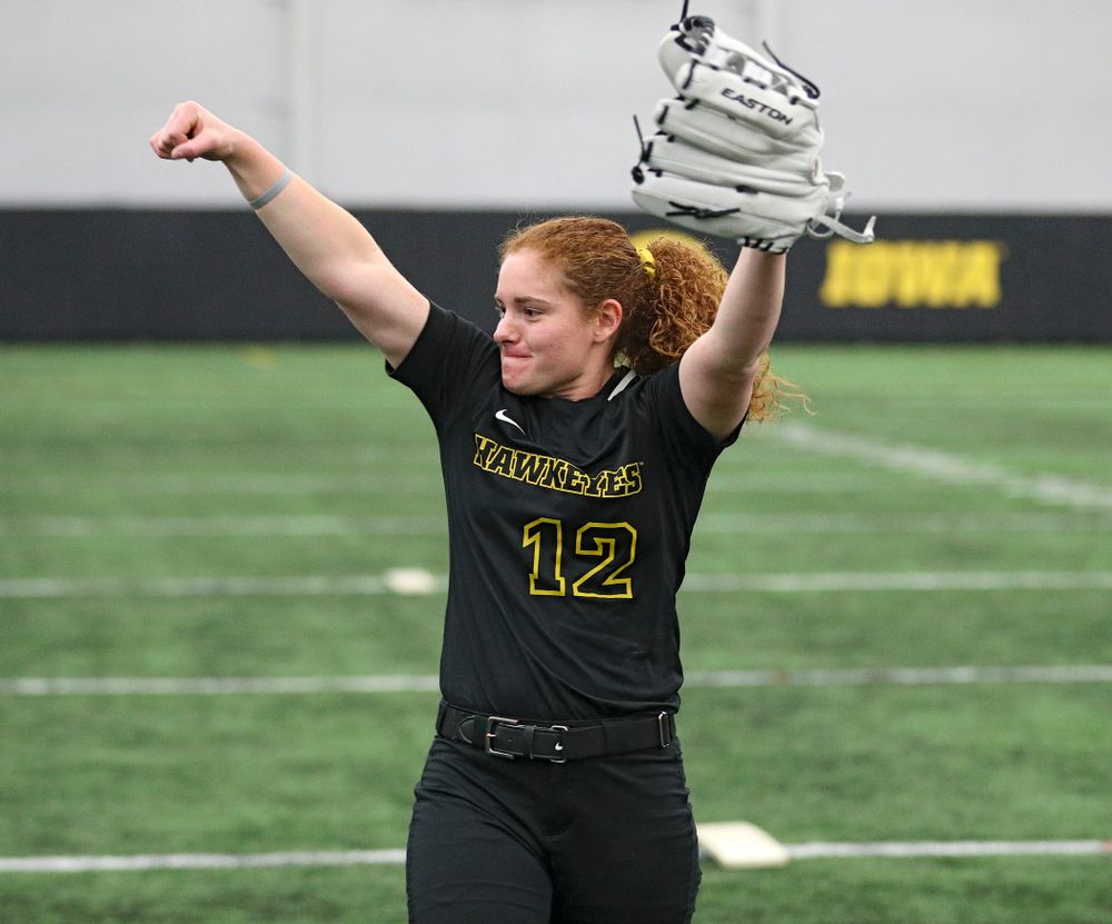 Iowa catcher/infielder Kate Claypool (12) pumps her fist after hitting a target with a ball during Iowa Softball Media Day at the Hawkeye Tennis and Recreation Complex in Iowa City on Thursday, January 30, 2020. (Stephen Mally/hawkeyesports.com)