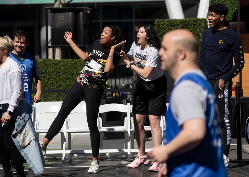 Iowa Hawkeyes forward Megan Gustafson (10) and UCONNÕs Napheesa Collier cheer on the athletes during a Special Olympics Event Friday, April 12, 2019 in the XBOX Plaza at LA Live.  (Brian Ray/hawkeyesports.com)