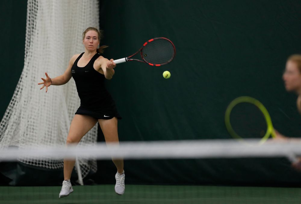 Iowa's Anastasia Reimchen and Montana Crawford play a doubles match against Marquette 