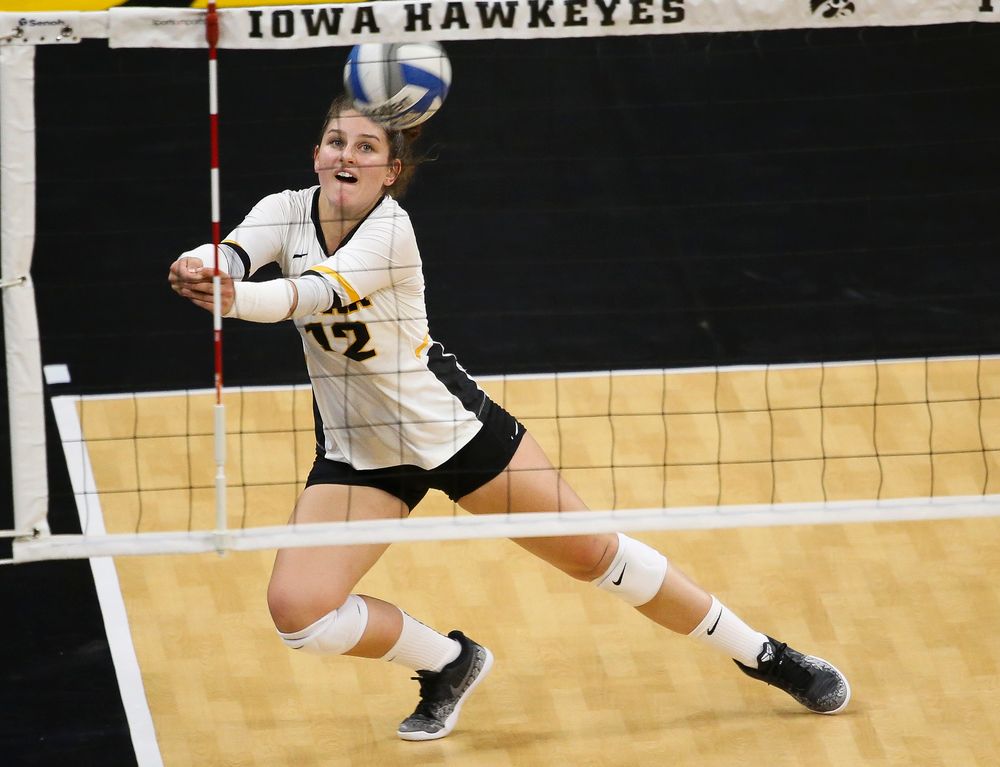 Iowa Hawkeyes defensive specialist Emily Bushman (12)