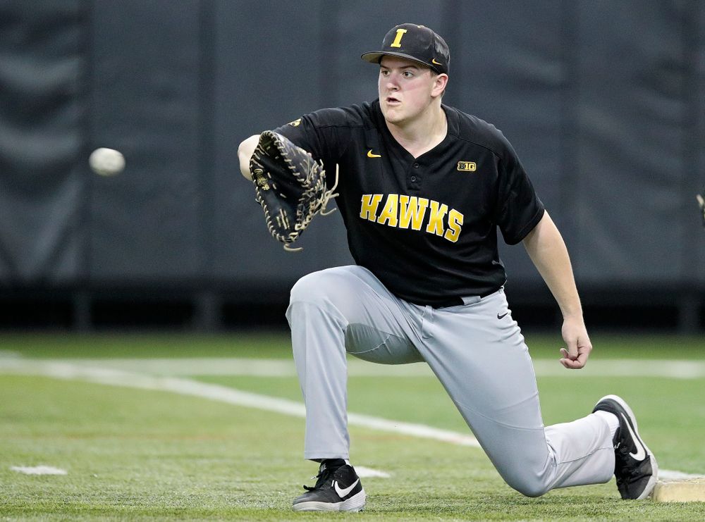 Iowa Hawkeyes first baseman Peyton Williams (45) pulls in a throw during practice at the Hansen Football Performance Center in Iowa City on Friday, January 24, 2020. (Stephen Mally/hawkeyesports.com)