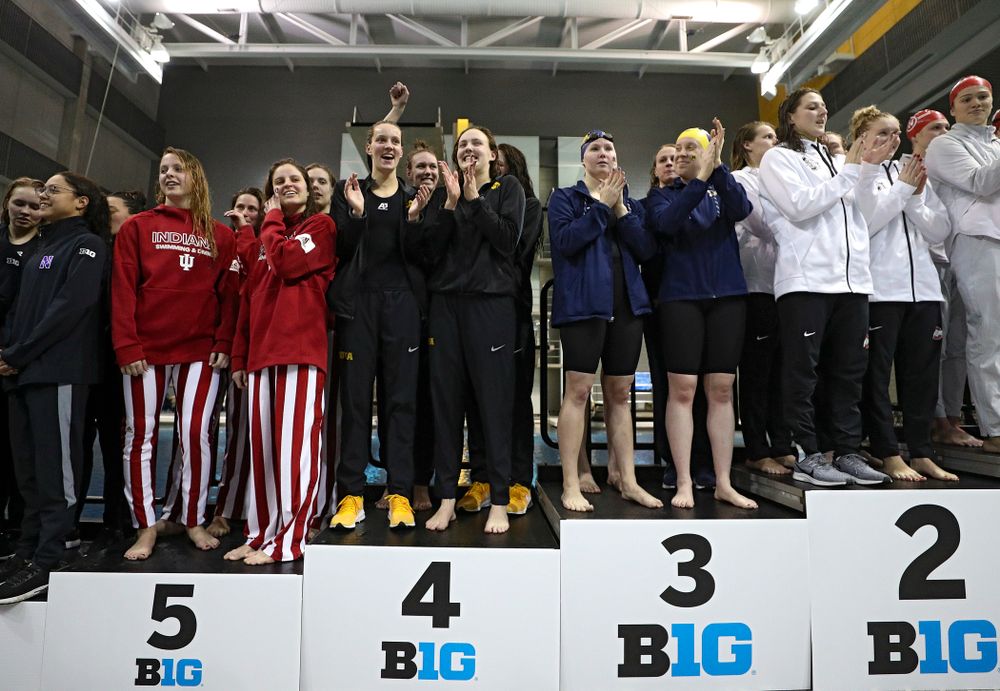 Iowa’s Hannah Burvill, Allyssa Fluit, Emilia Sansome, and Macy Rink on the podium after placing fourth in the 800 yard freestyle relay event during the 2020 Big Ten Women’s Swimming and Diving Championships at the Campus Recreation and Wellness Center in Iowa City on Wednesday, February 19, 2020. (Stephen Mally/hawkeyesports.com)