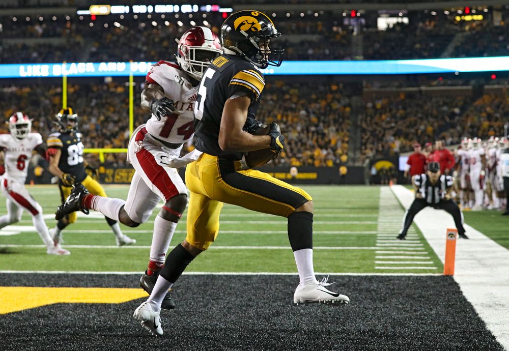 Iowa Hawkeyes wide receiver Oliver Martin (5) pulls in a 9-yard touchdown reception during the third quarter of their game at Kinnick Stadium in Iowa City on Saturday, Aug 31, 2019. (Stephen Mally/hawkeyesports.com)