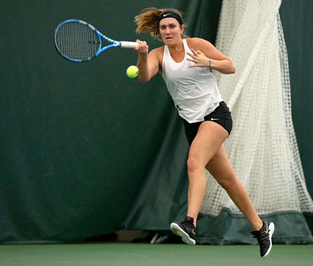 Iowa’s Ashleigh Jacobs returns a shot during her doubles match at the Hawkeye Tennis and Recreation Complex in Iowa City on Sunday, February 23, 2020. (Stephen Mally/hawkeyesports.com)