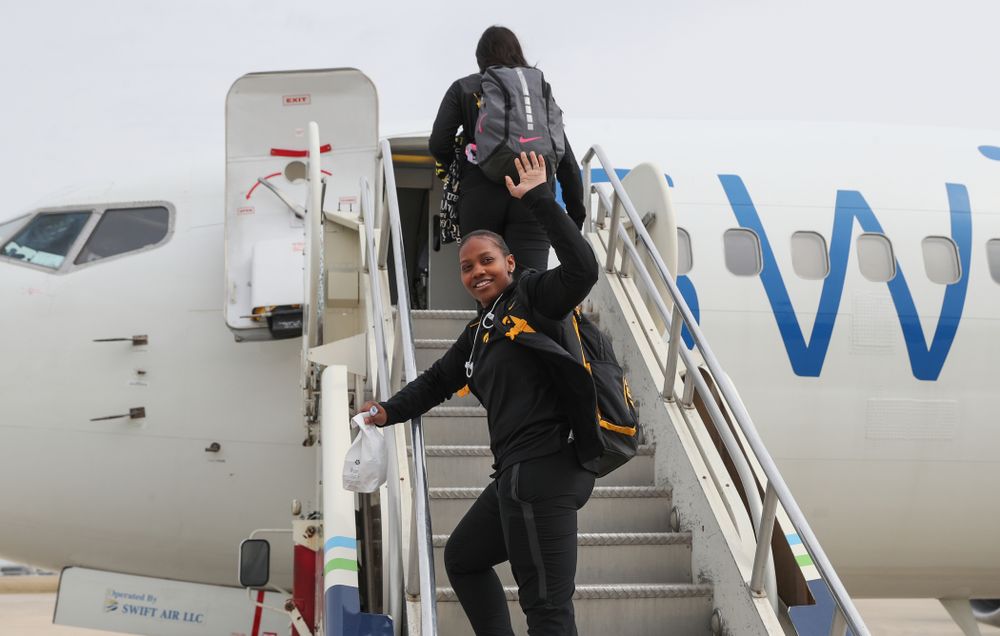 Iowa Hawkeyes guard Zion Sanders (24) boards the team plane to Greensboro, NC for the Regionals of the 2019 NCAA Women's Basketball Championships Thursday, March 28, 2019 at the Eastern Iowa Airport. (Brian Ray/hawkeyesports.com)