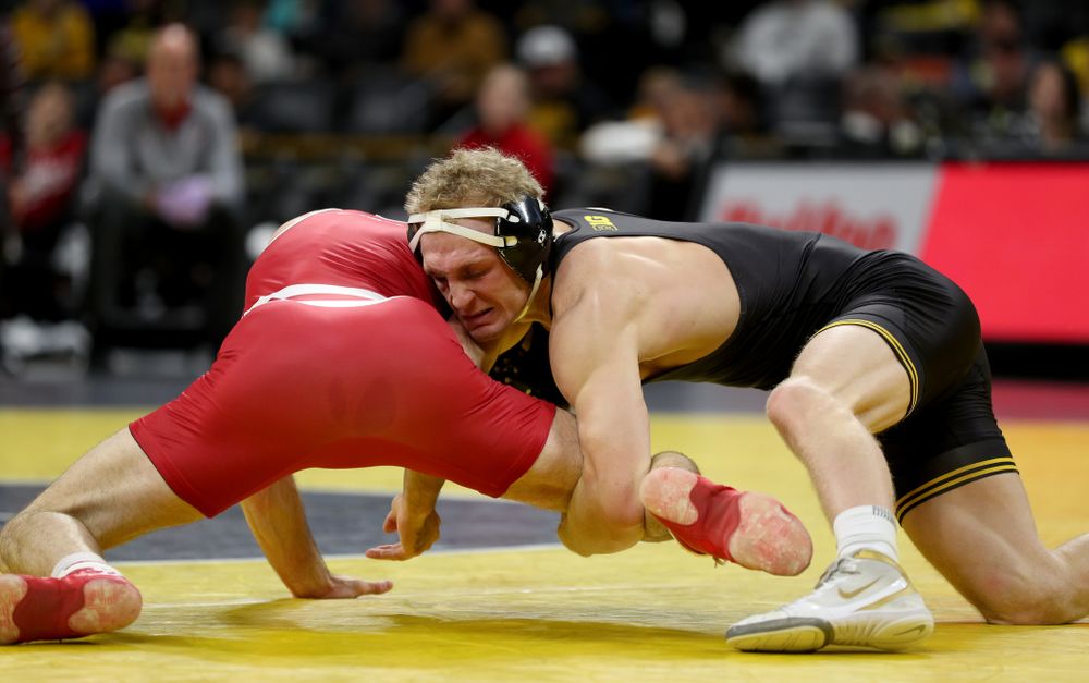 IowaÕs Kaleb Young wrestles WisconsinÕs Garrett Model at 157 pounds Sunday, December 1, 2019 at Carver-Hawkeye Arena. Young won the match 12-6. (Brian Ray/hawkeyesports.com)