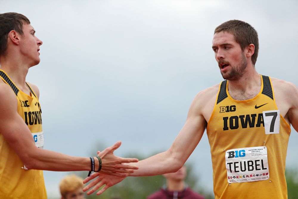 Iowa's Matt Manternach (from left) and Nolan Teubel slap hands after running the men’s 800 meter event on the third day of the Big Ten Outdoor Track and Field Championships at Francis X. Cretzmeyer Track in Iowa City on Sunday, May. 12, 2019. (Stephen Mally/hawkeyesports.com)