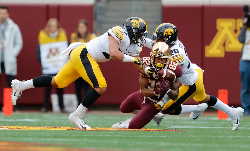 Iowa Hawkeyes defensive back Amani Hooker (27) and defensive back Julius Brents (20) break up a pass against the Minnesota Golden Gophers Saturday, October 6, 2018 at TCF Bank Stadium. (Brian Ray/hawkeyesports.com)