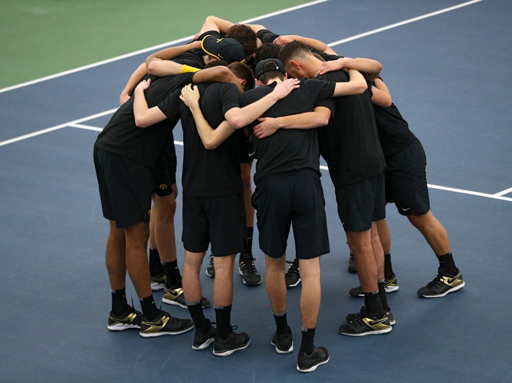 The Hawkeyes huddle before their match at the Hawkeye Tennis and Recreation Complex in Iowa City on Friday, March 6, 2020. (Stephen Mally/hawkeyesports.com)