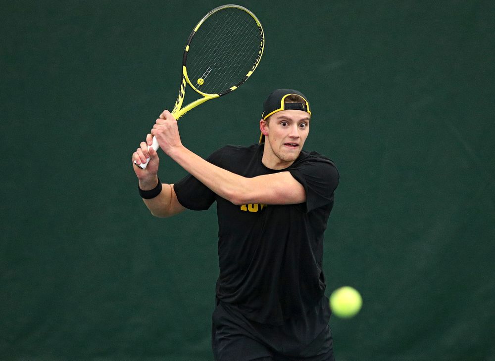 Iowa’s Joe Tyler returns a shot during his doubles match at the Hawkeye Tennis and Recreation Complex in Iowa City on Friday, March 6, 2020. (Stephen Mally/hawkeyesports.com)