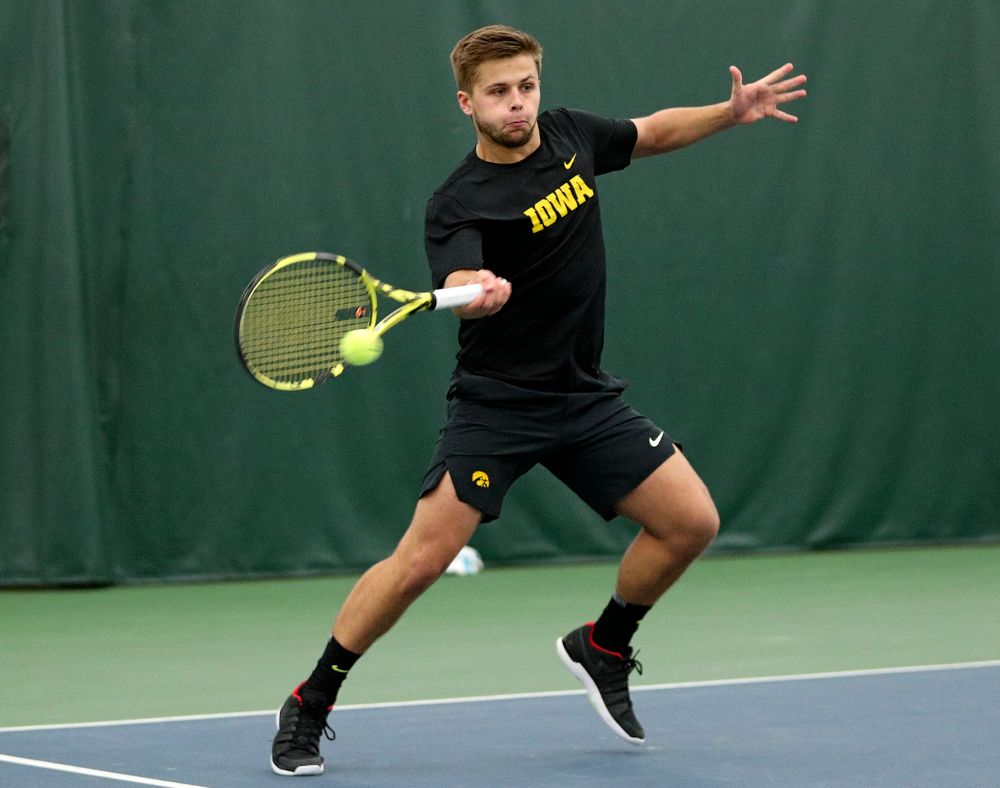 Iowa’s Will Davies returns a shot during his doubles match at the Hawkeye Tennis and Recreation Complex in Iowa City on Thursday, January 16, 2020. (Stephen Mally/hawkeyesports.com)