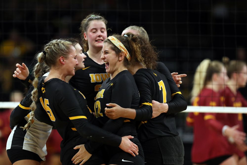 Iowa Hawkeyes defensive specialist Maddie Slagle (15) and defensive specialist Emily Bushman (12) celebrate a point against the Iowa State Cyclones Saturday, September 21, 2019 during the Iowa Corn Cy-Hawk Series Tournament at Carver-Hawkeye Arena. (Brian Ray/hawkeyesports.com)