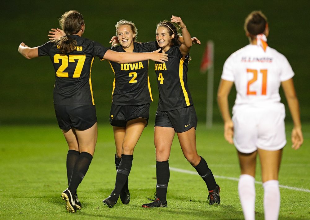 Iowa forward Samantha Tawharu (27), midfielder Hailey Rydberg (2), and forward Kaleigh Haus (4) celebrate together after Haus scored a goal during the second half of their match against Illinois at the Iowa Soccer Complex in Iowa City on Thursday, Sep 26, 2019. (Stephen Mally/hawkeyesports.com)
