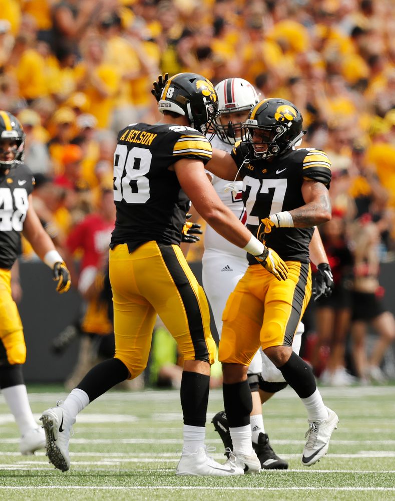 Iowa Hawkeyes defensive back Amani Hooker (27) and defensive end Anthony Nelson (98) against the Northern Illinois Huskies Saturday, September 1, 2018 at Kinnick Stadium. (Brian Ray/hawkeyesports.com)