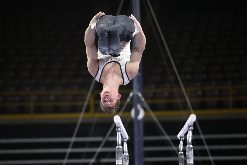 Iowa's Stewart Brown competes on the parallel bars against UIC and Minnesota Saturday, February 2, 2019 at Carver-Hawkeye Arena. (Brian Ray/hawkeyesports.com)
