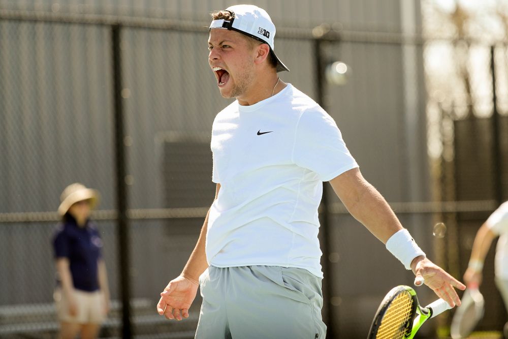 Iowa's Will Davies celebrates after winning his match against Michigan at the Hawkeye Tennis and Recreation Complex in Iowa City on Sunday, Apr. 21, 2019. (Stephen Mally/hawkeyesports.com)