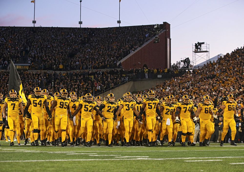 The Hawkeyes swarm as they take the field before their game at Kinnick Stadium in Iowa City on Saturday, Oct 12, 2019. (Stephen Mally/hawkeyesports.com)